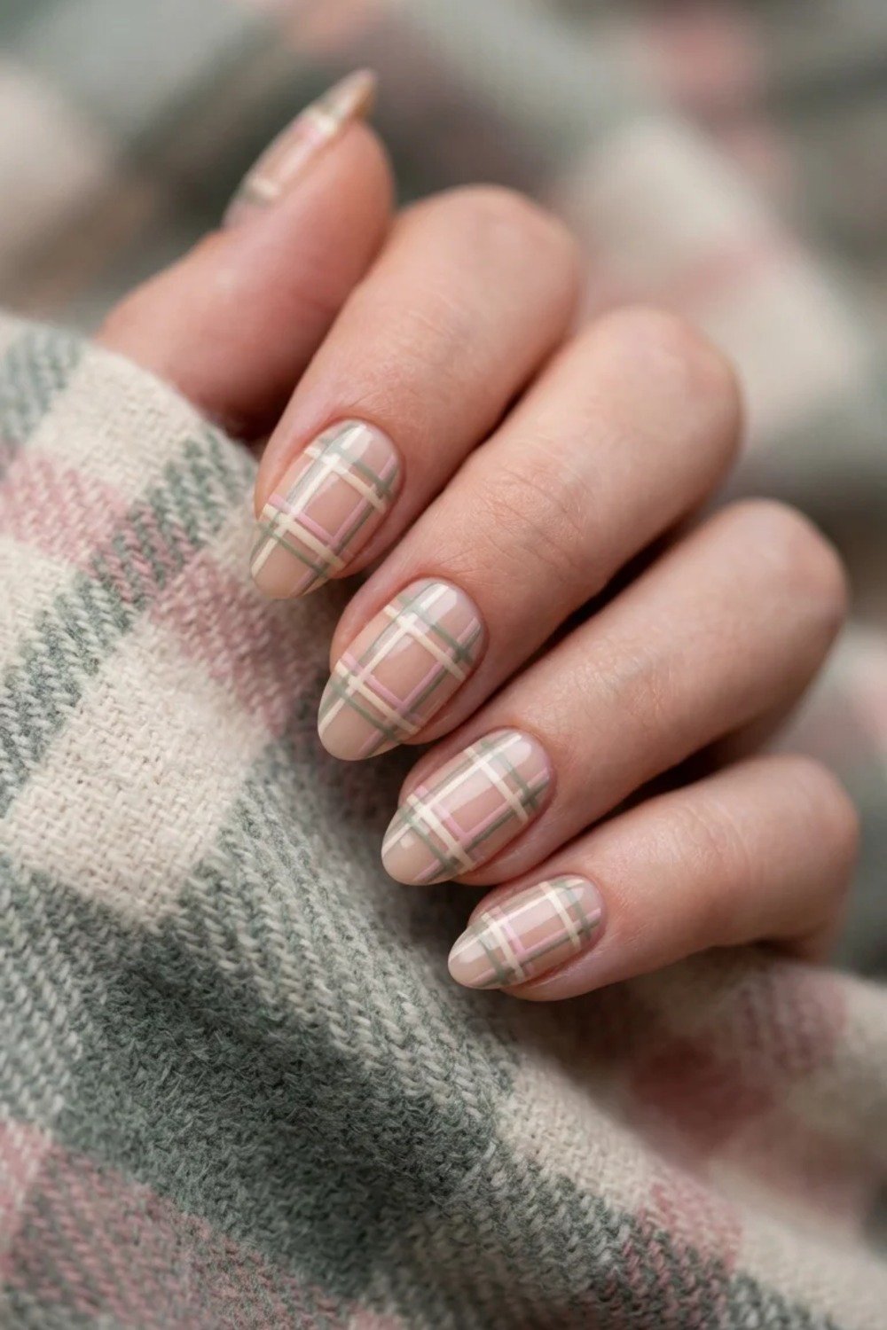 Soft tartan plaid nail art in festive tones on short nails
